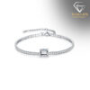 Adjustable silver tennis bracelet featuring a radiant emerald-cut moissanite centerpiece | D-Carats.