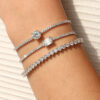 1ct emerald-cut moissanite bracelet in solid 925 sterling silver with a detailed diamond color and VVS clarity grading chart | D-Carats.