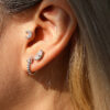 Cartilage earring on ear with half carat moissanite diamond in sterling silver | D-Carats.
