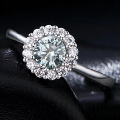 Beautifully unique green moissanite halo ring in sterling silver | D-Carats.