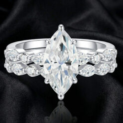 Close-up view of a marquise-cut moissanite diamond engagement ring set | D-Carats.
