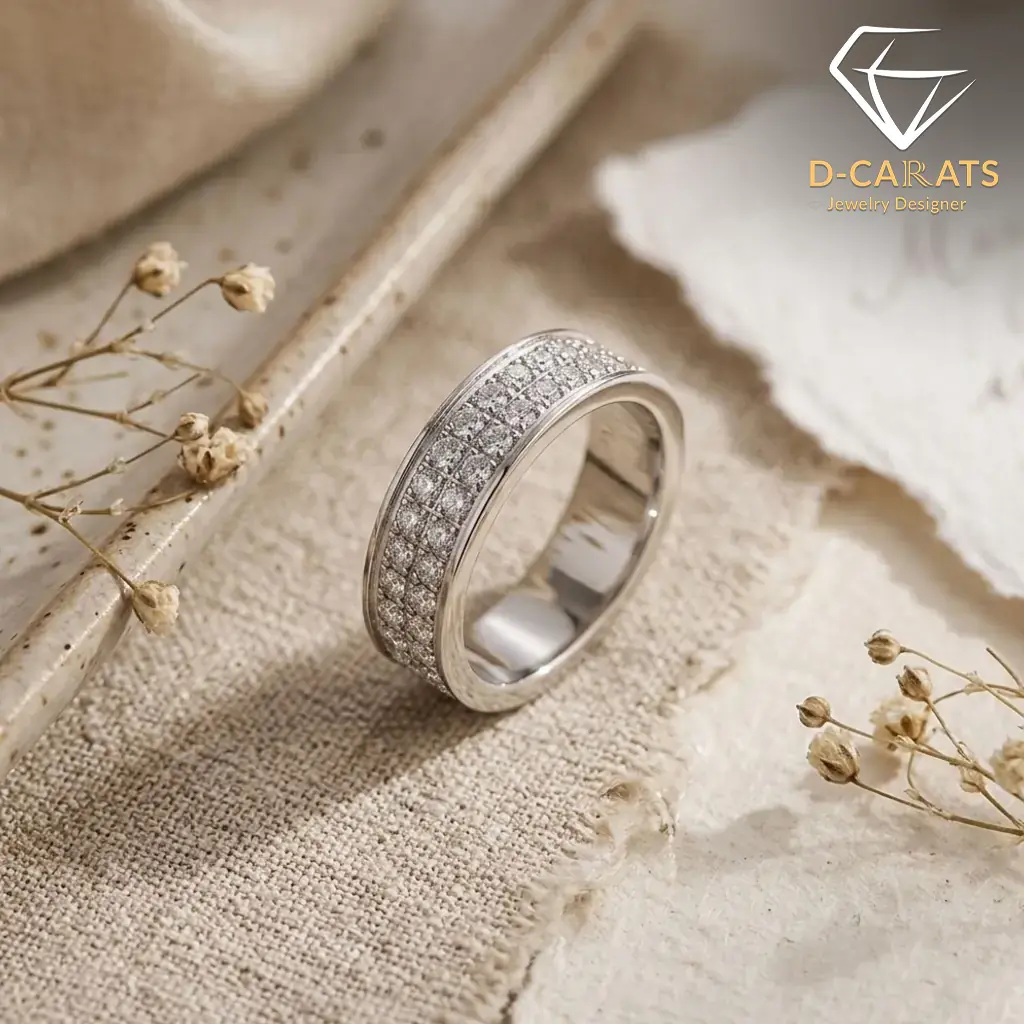 Moissanite eternity band ring in platinum-plated silver 3 Close-up side view of a sparkling moissanite eternity band ring resting on textured beige linen with dried florals