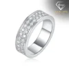 Moissanite eternity band ring in platinum-plated silver 29 Close-up angled view of a platinum-plated silver eternity band ring featuring two rows of shimmering round moissanite stones