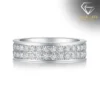 Moissanite eternity band ring in platinum-plated silver 28 Side view of a double row moissanite eternity band ring in polished platinum-plated silver showing brilliant square stones