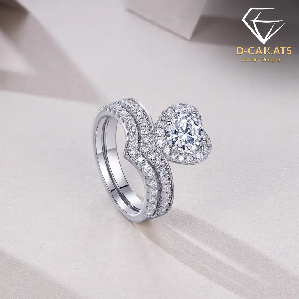 Moissanite Heart Halo Engagement Ring Set 13 Close-up side view of a silver heart shaped engagement ring set featuring a shimmering moissanite halo and paved band