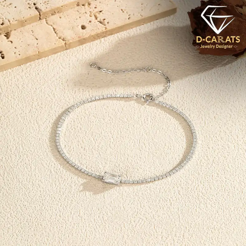 S925 sterling silver chain bracelet with a 1.00ct D-color VVS1-clarity emerald-cut moissanite and cubic zirconia accent stones | D-Carats.