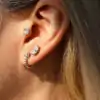 Cartilage earring on ear with half carat moissanite diamond in sterling silver | D-Carats.