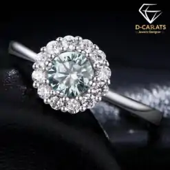 Halo ring featuring a 0.5ct round-cut green moissanite centerstone with a classic white halo setting in high-polish S925 sterling silver | D-Carats.