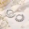 Surgical titanium segment hoop with clustered crystal stones | D-Carats.