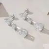 Moissanite fine jewelry 3 stones drop earrings in sterling silver | D-Carats.