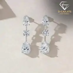 Sparkling moissanite 3 stones drop earrings in sterling silver | D-Carats.