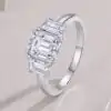 3-Stone engagement ring <br> emerald cut. 10 Romantic emerald cut moissanite 3-stone engagement ring in sterling silver | D-Carats.