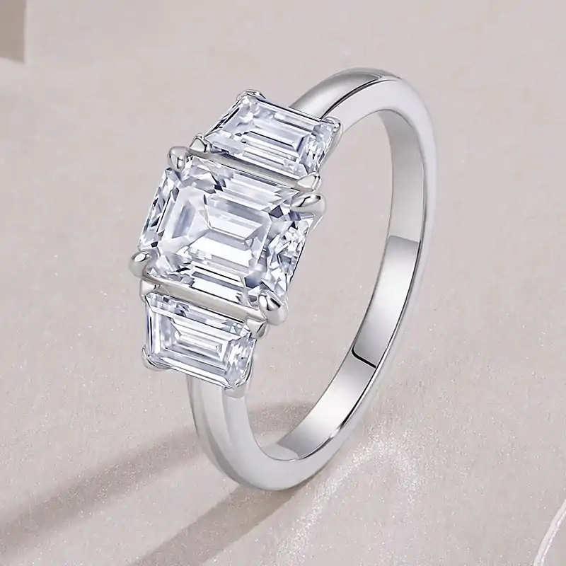 3-Stone engagement ring <br> emerald cut. 5 Romantic emerald cut moissanite 3-stone engagement ring in sterling silver | D-Carats.