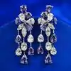 Silberne Ohrringe mit blauen Zirkon-Kronleuchtern. 9 Exquisite Kronleuchter-Ohrringe aus Silber mit blauen Zirkonen | D-carats.