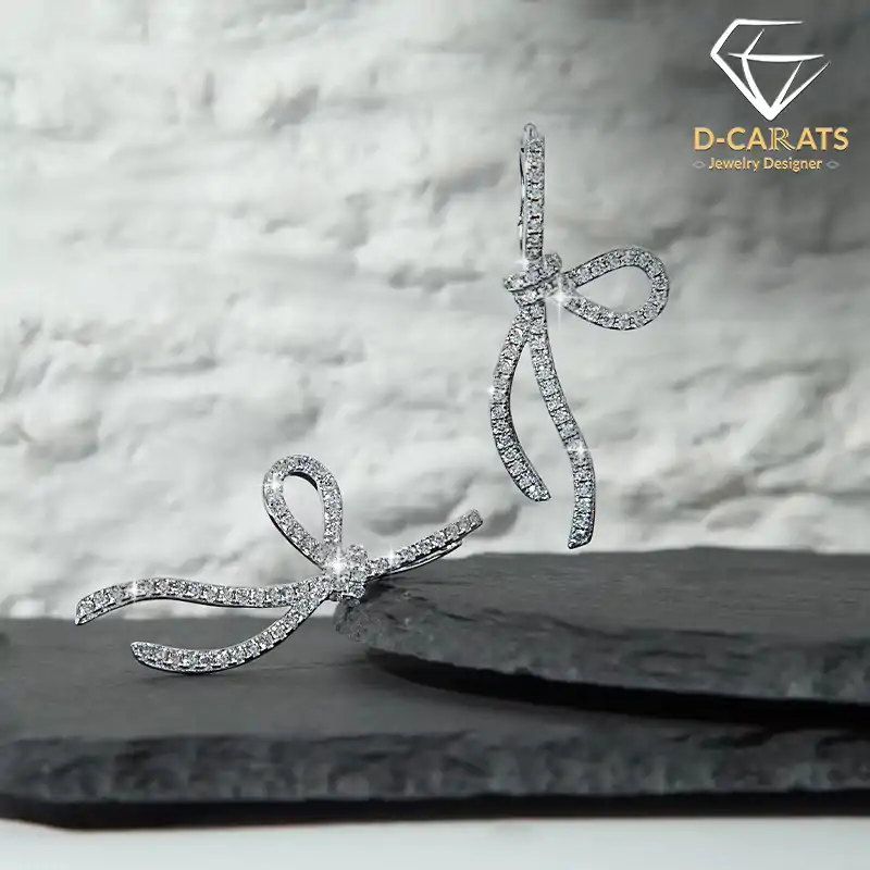 Elegant Moissanite Bow Dangle Earrings in Sterling Silver | D-Carats.