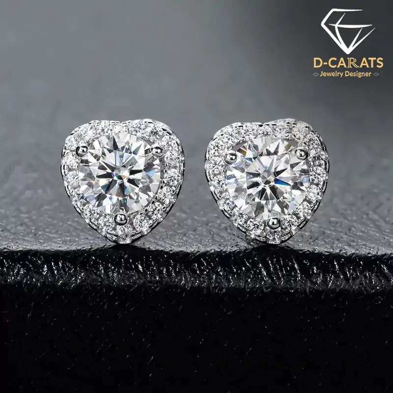 Expensive-looking heart shape moissanite halo stud earrings in sterling silver | D-Carats.
