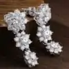Pendientes colgantes de moissanita en plata con diseño de girasol. 22 Preciosos pendientes colgantes de plata con moissanita en forma de girasol | D-carats.