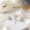Moissanite jewelry set with rose-shaped design, sterling silver necklace and earrings | D-Carats.