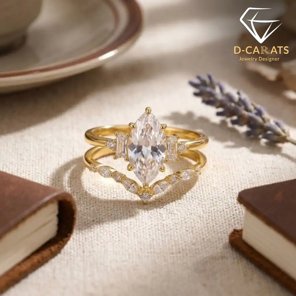 Marquise Moissanite Bridal Ring Set 5 Close-up of a gold marquise moissanite bridal ring set with a curved band featuring small sparkling diamonds on linen