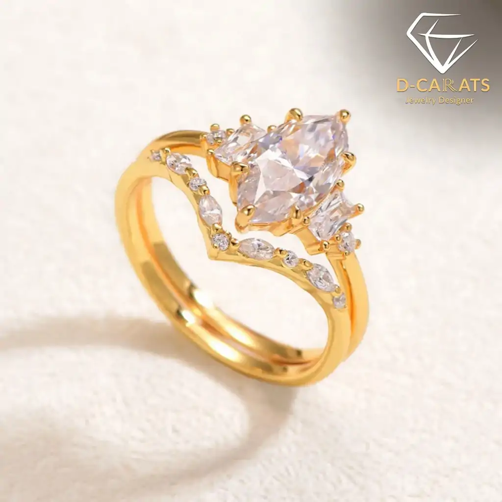 Marquise Moissanite Bridal Ring Set 12 Close-up of a gold marquise moissanite bridal ring set featuring a central pointed gem and small side accent stones