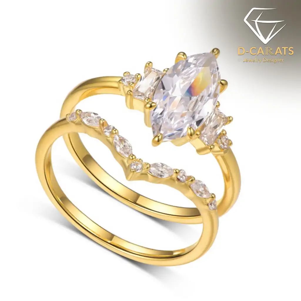 Marquise Moissanite Bridal Ring Set 13 Close-up of a gold marquise moissanite bridal ring set featuring a curved V-shaped band with small shimmering stones
