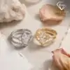 Marquise Moissanite Bridal Ring Set 5 Gold and silver marquise moissanite bridal ring sets displayed side by side among soft petals and white crystals