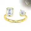 Close-up of a gold moissanite toi moi ring featuring a round brilliant cut stone and a rectangular emerald cut gem