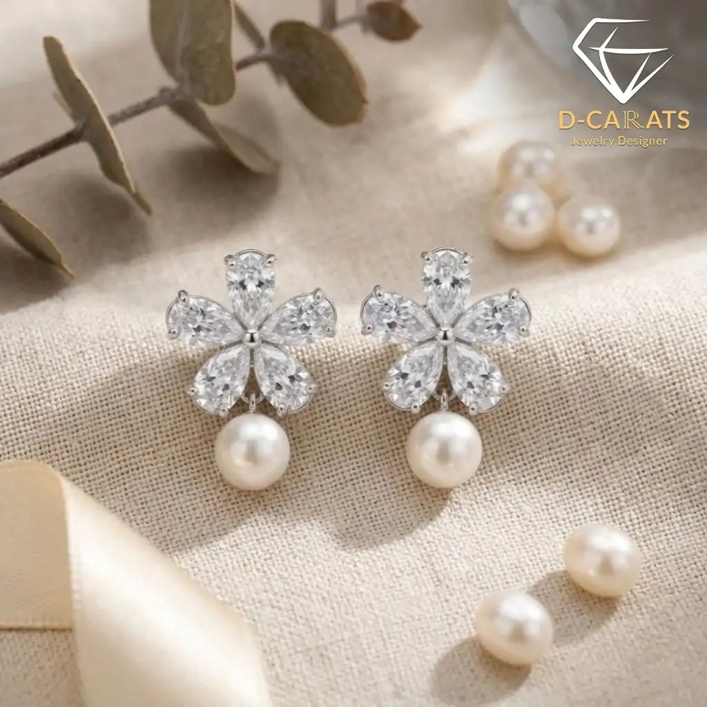 Pendientes colgantes de perla y plata con flor de circón 9 Primer plano de pendientes colgantes de perla plateada con flores de circón talla marquesa sobre una superficie de tela de lino beige